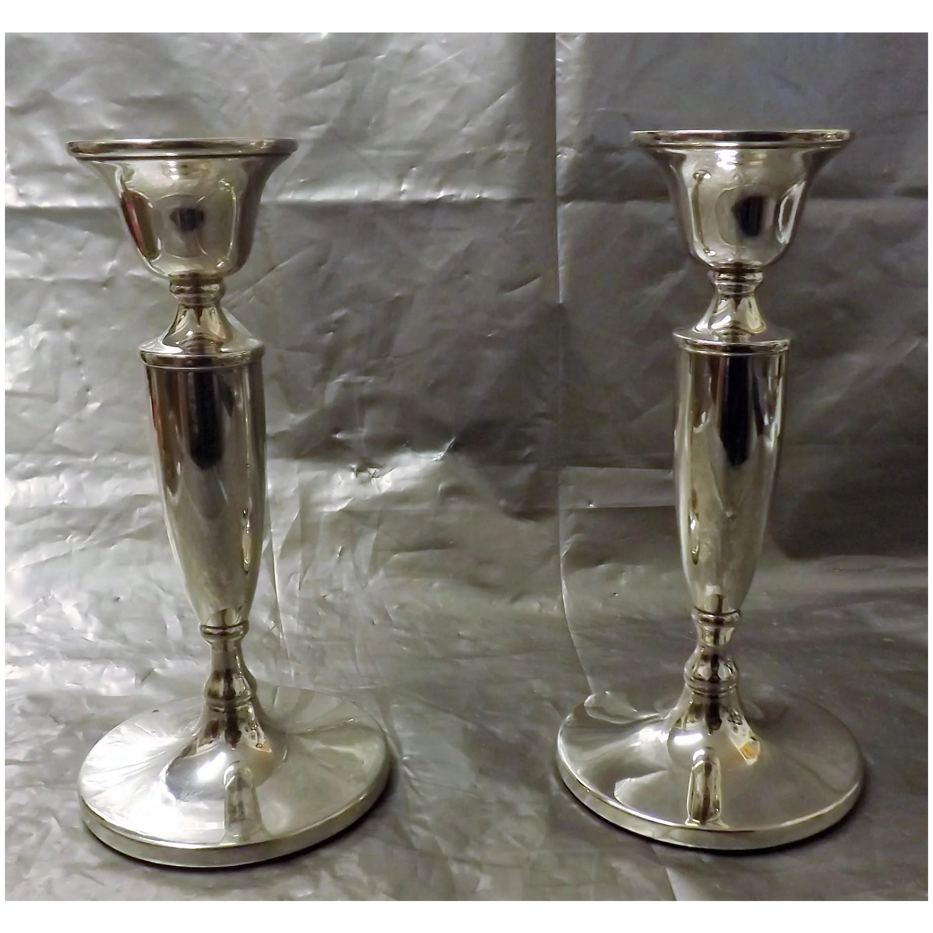 A Pair of Sterling Silver Georgian Revival Candlesticks